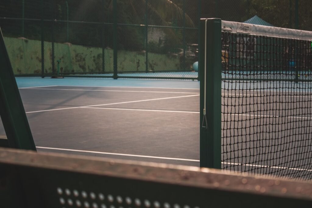 Coast Guard Tennis Loses to Emerson in NEWMAC Opener Despite Reice's Singles Win